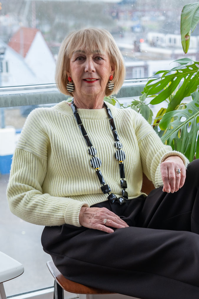 Wide black trousers with the soft yellow jumper