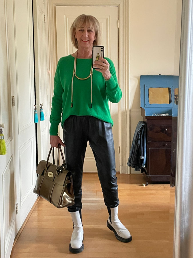 Leather jogging trousers with a green jumper