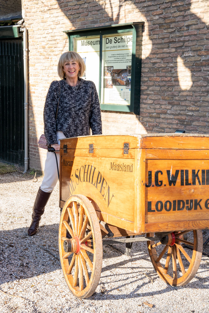 Big black and grey jumper with cream trousers