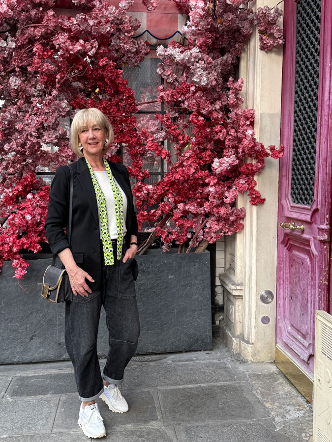 Outfit with black blazer and colourful belt as scarf