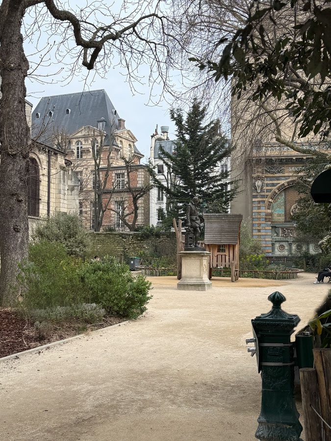 Statue near church at Boulevard Saint Germain