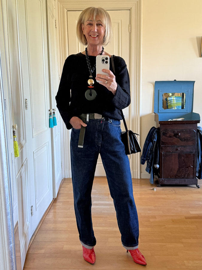 HIGH jeans with black jumper and orange boots.