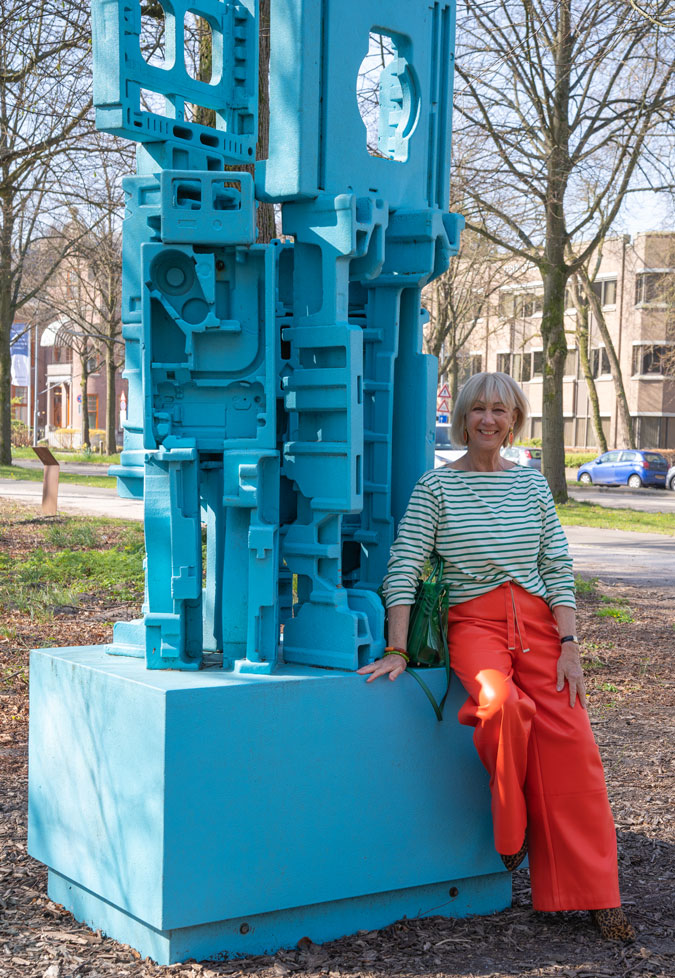 Orange pleather trousers with a green and white striped top