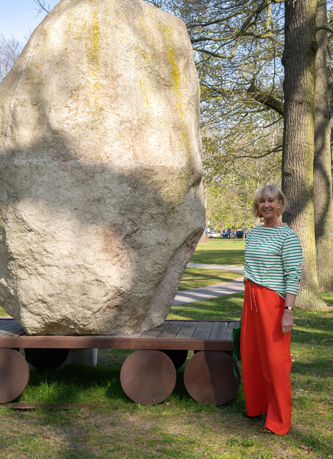 Orange pleather trousers with a green and white striped top