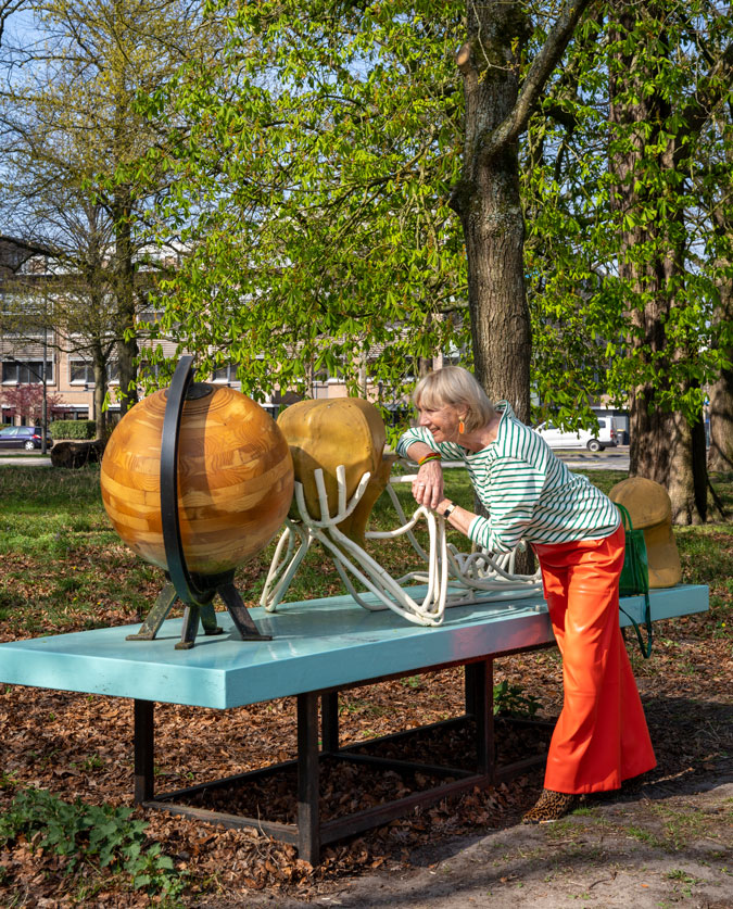 Orange pleather trousers with a green and white striped top