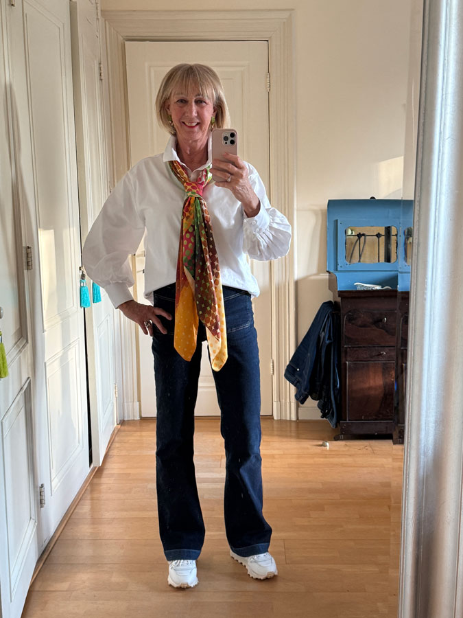 Jeans with a white shirt and a colourful scarf