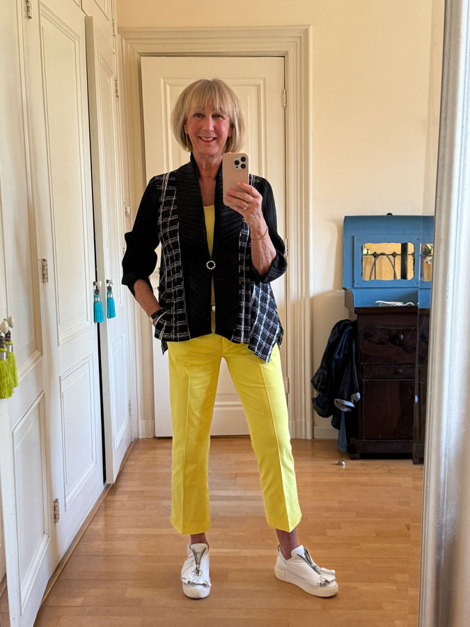 Blue and white pleated cardigan with yellow trousers