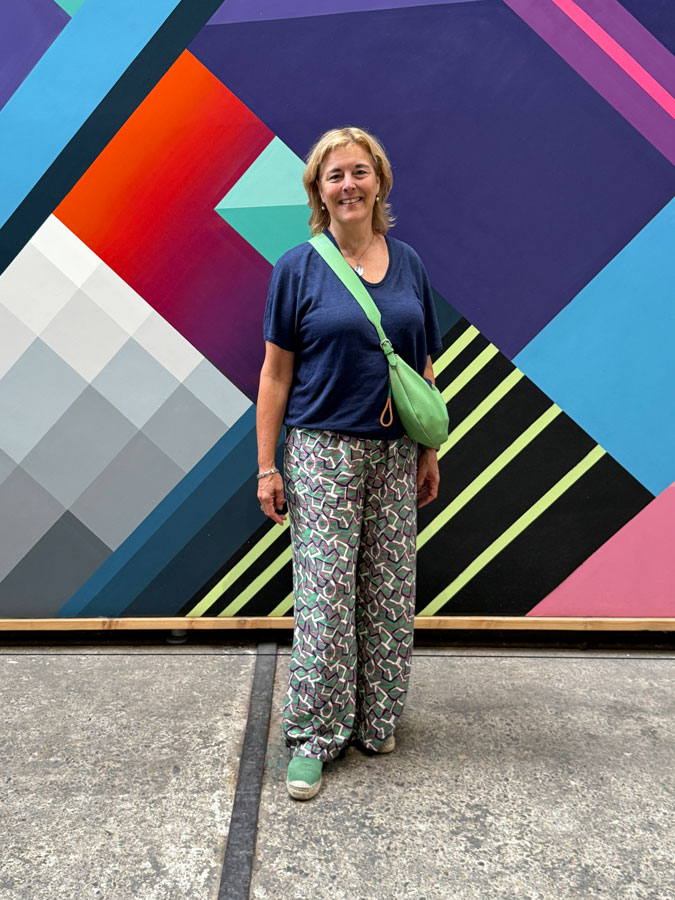 Katrien at Straat Museum, mural by artist Nase