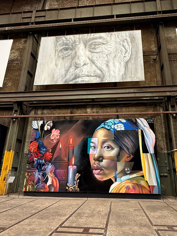 Straat Museum; artist Bottom mural by Elle, top mural by Guido van Helten