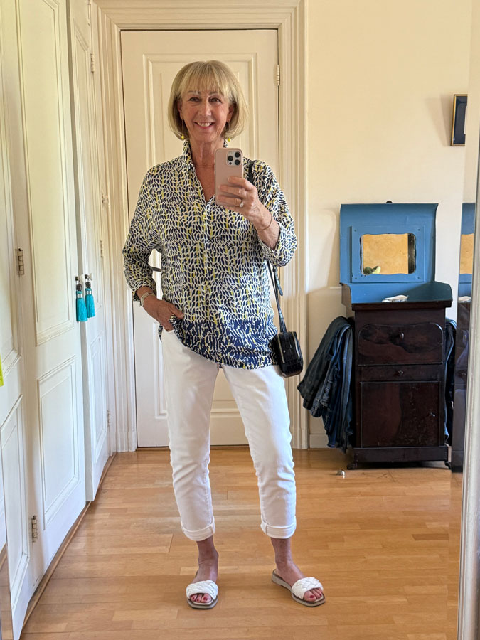Summer blouse on narrow white jeans