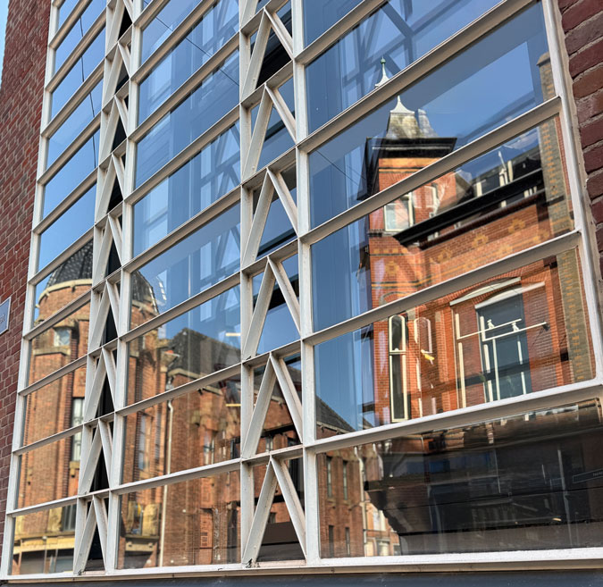 Building reflected in another building