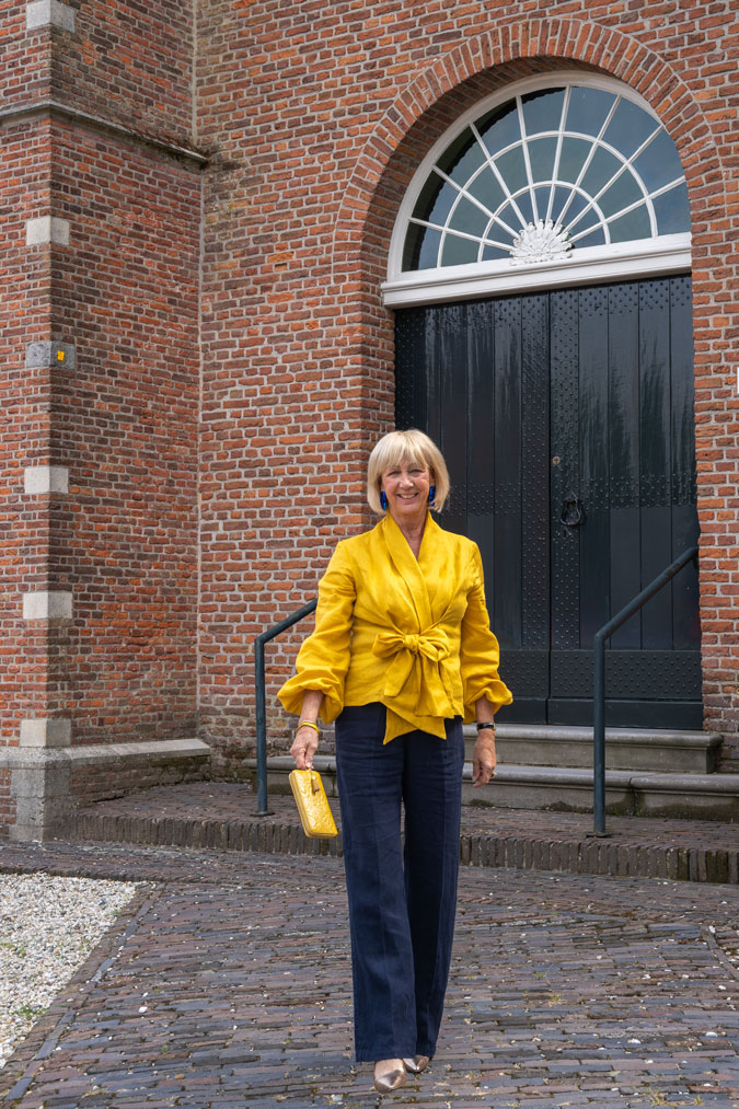 Golden yellow blouse with blue linen trousers