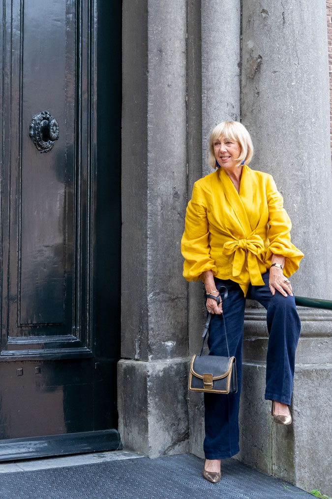 Golden yellow blouse with blue linen trousers