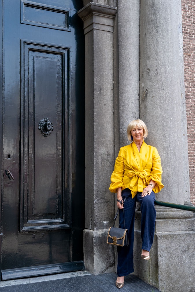 Golden yellow blouse with blue linen trousers