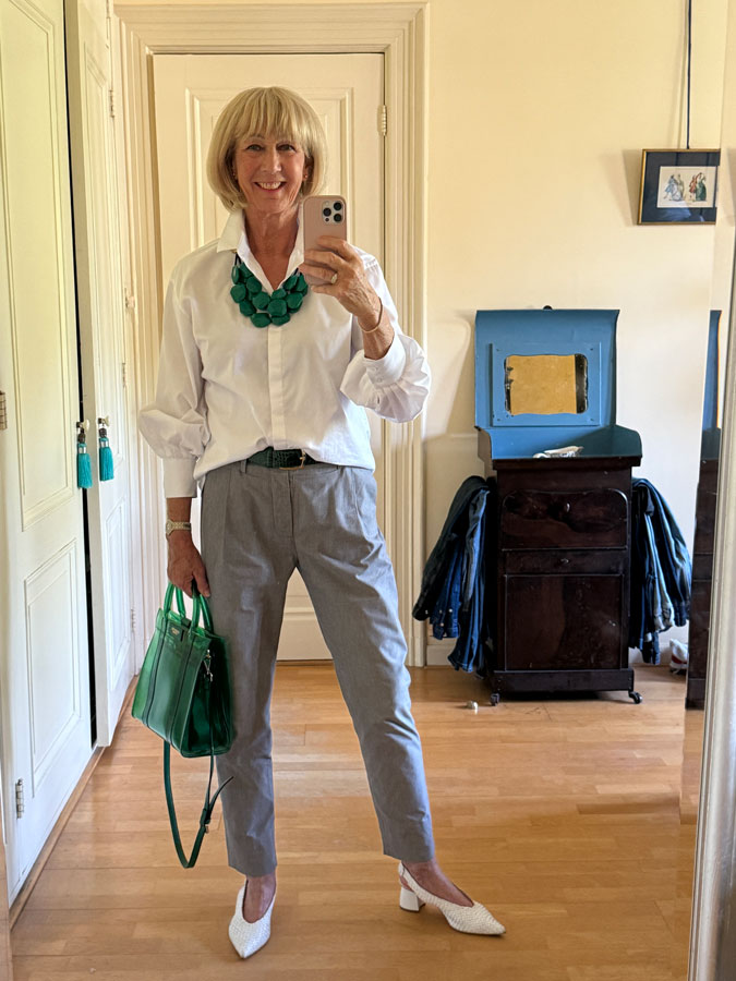 Grey trousers with a simple white shirt