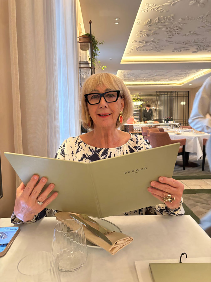 Wide white trousers with a blue and white top