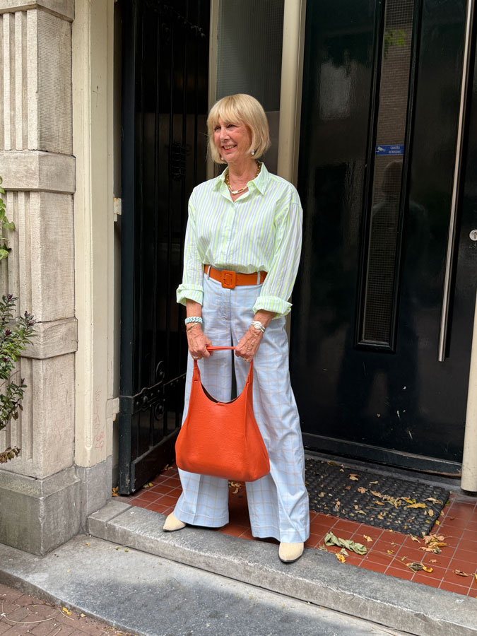 Light blue checked trousers with a yellow striped shirt
