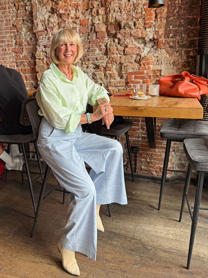 Light blue checked trousers with a yellow striped shirt