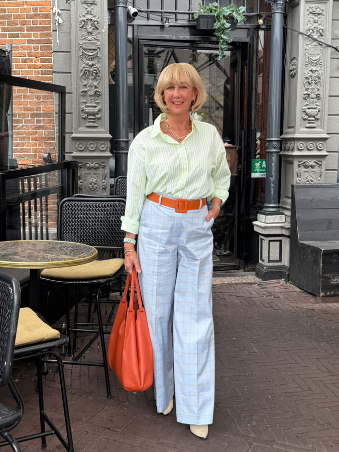 Light blue checked trousers with a yellow striped shirt