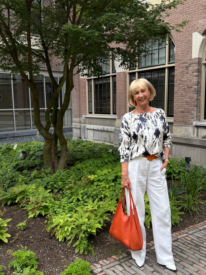 Wide white trousers with a blue and white top