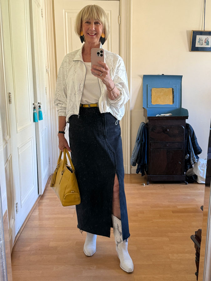 Black jeans skirt with white jacket and cowboy boots