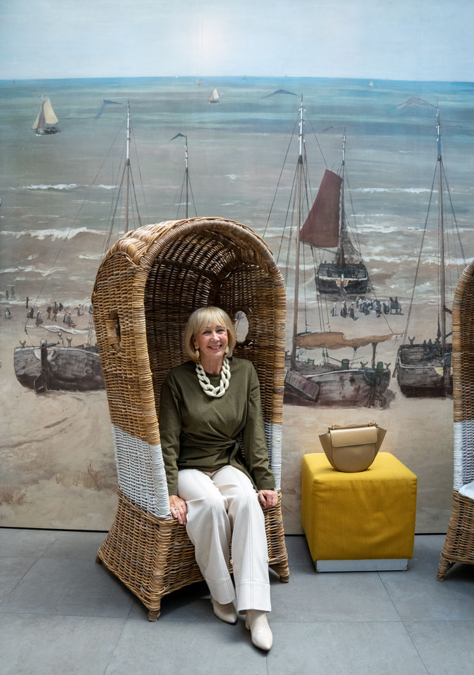 Cream trousers with a green top