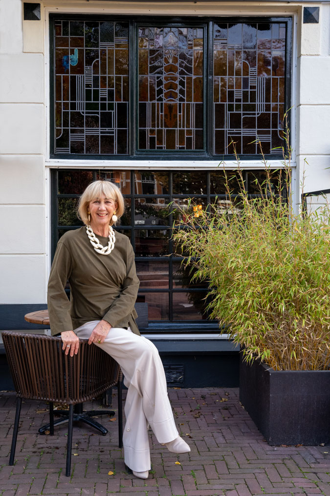 Cream trousers with a green top