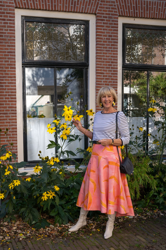 Pattern mixing with a pink skirt and a striped top
