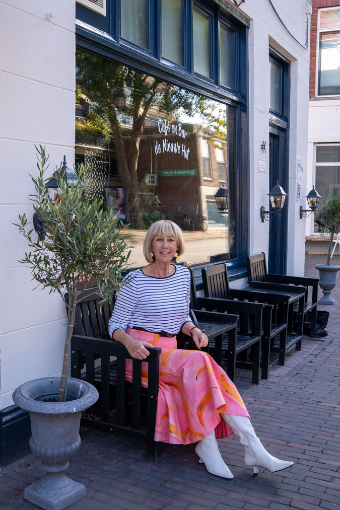 Pattern mixing with a pink skirt and a striped top