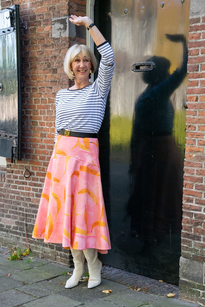 Pattern mixing with a pink skirt and a striped top