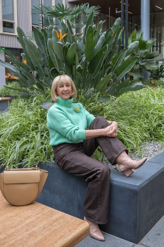 Bright green jumper with brown jeans