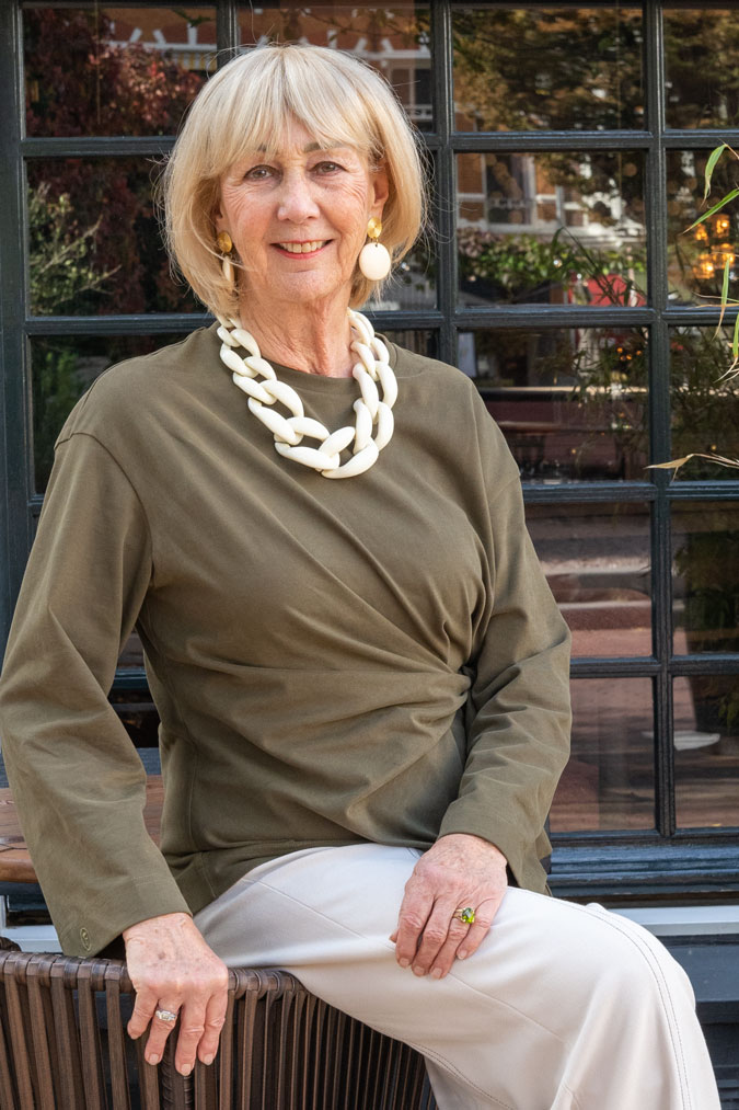 Cream trousers with a green top