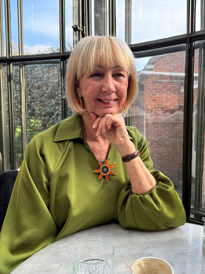 Brown jeans with a green top