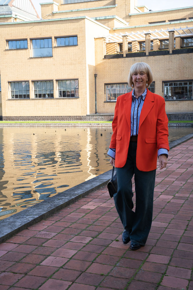 Orange blazer with a blue and white shirt