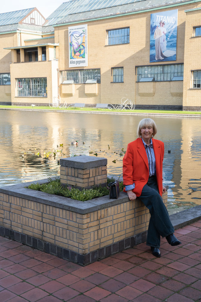 Orange blazer with a blue and white shirt