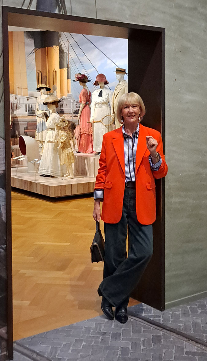 Orange blazer with a blue and white shirt at Titanic & Fashion Exhibition